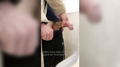 Jerk off a guy's dick in a public toilet. risky