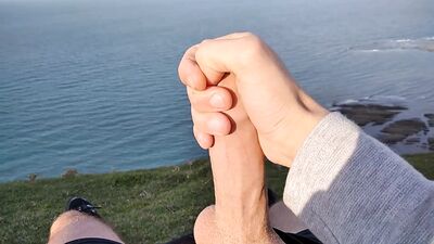 Huge Dirty Cock Gets Handjob In Public And Squirts A Lot Of Thick Sperm In Front Of The Beach