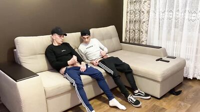 Two friends jerk off in sporwear