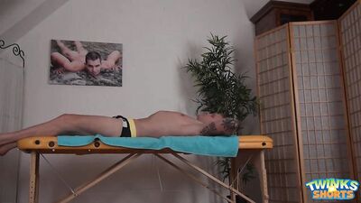 Gay Porn Fantasy Fulfilled: Muscular Athlete Massages and Kisses a Young Man in Speedos