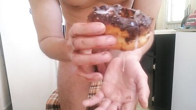 Handsome man fucks a donut, cums on it and eats it