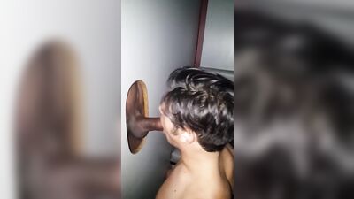 Sucking big black cock through glory hole at Tokyo Valentino in ATL