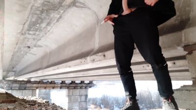 Dick Russian straight masturbates and pisses on a condom under the bridge