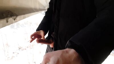 Dick Russian straight masturbates and pisses on a condom under the bridge