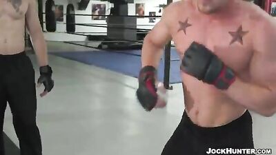 Rough and Ready: Gay MMA Fighters Go Head-to-Head in a Steamy Match, Ending with a Muscular Man Taking Control in the Ring