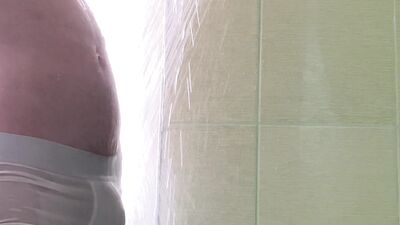 Cocky spies get caught in a steamy shower romp.