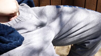 Cumming outside while neighbors watch