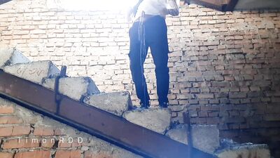 Dominant male pisses and fucks an imaginary whore in an abandoned building