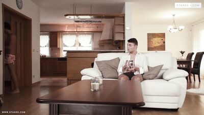 "Two hunky men rub their bodies against each other in an erotic embrace."