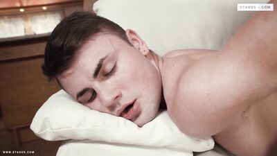 "Two hunky men rub their bodies against each other in an erotic embrace."