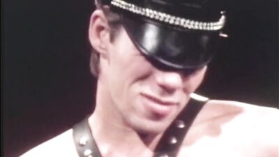 Rewritten as: "Leather-clad biker fucks sexy sailor jock in a hardcore porn video by Falcon Studios, starring Tim Kramer and Mac Turner."