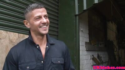 Rewritten as: Man from Britain enjoys forceful penetration of muscular derriere within workshop.