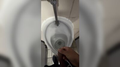 Male models get it on with each other while urinating in the restroom of a popular London hotspot.