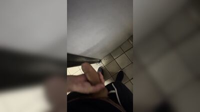 Male models get it on with each other while urinating in the restroom of a popular London hotspot.