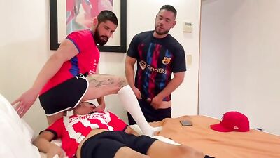Three soccer players have a sexual encounter.