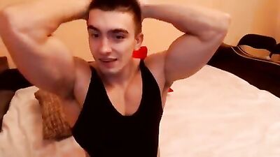 Big muscular guy jerks off and cums on his webcam