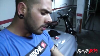 Two roughnecks dismantle a hot rod in a garage