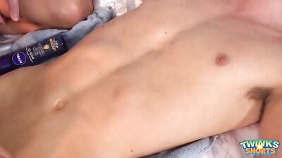 Young boy is lube up and getting massage.