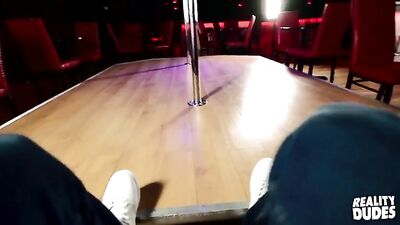 A hot male stripper demonstrates a pole dance for us